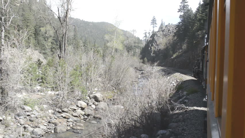 SAN JUAN NATIONAL FOREST, COLORADO - MAY 2013: The Durango & Silverton Narrow Gauge Railroad passes through San Juan National Forest along the Animas River en route from Durango To Silverton, Colorado