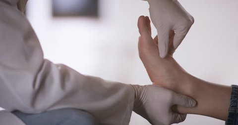 Orthopedist examining injured foot