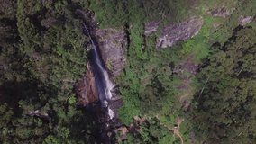 This stock video features an aerial drone shot from right featuring a waterfall. This waterfall in a Sri Lanka