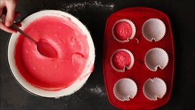 dough pink  raw lay out in a baking dish - cupcakes. Footage