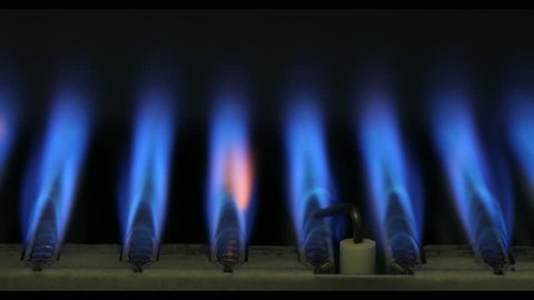 Burning of natural gas inside of boiler furnace 4K close-up