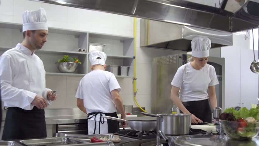 Cooks cooking chef tries out soup
