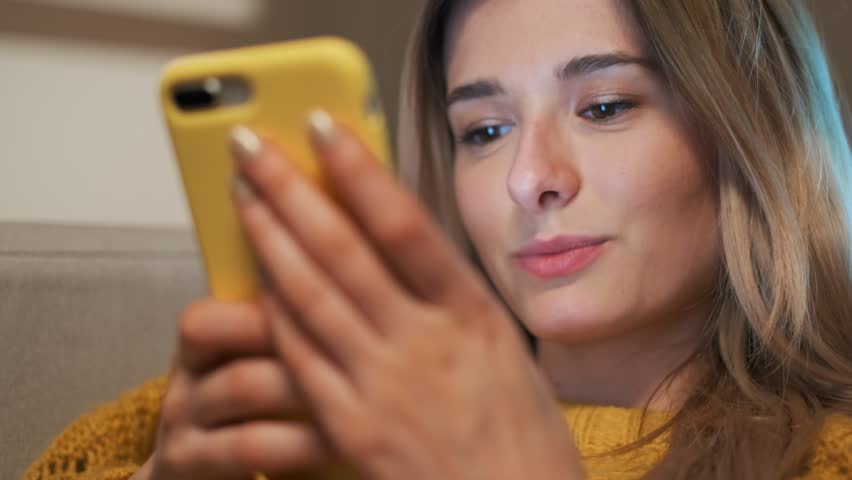 Woman scrolling, typing on touchscreen, using app and browsing on the internet