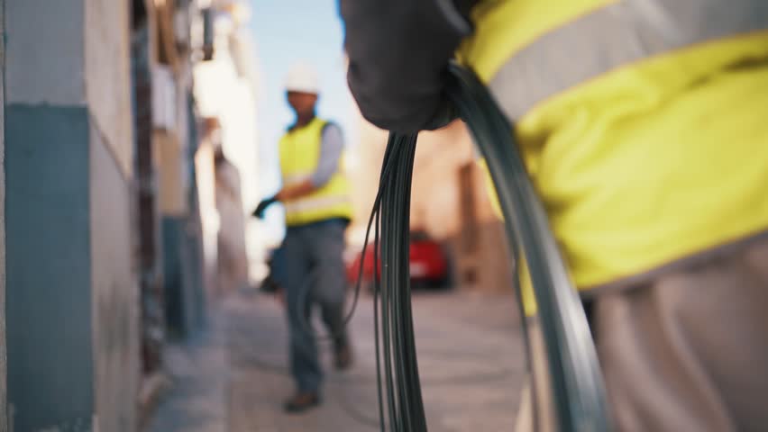 Close Up Technicians Working with Electrical Cables on Residential Street Royalty-Free Stock Footage #1023969485