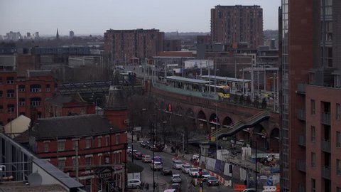 Aerial view of manchester with train line  and commuter trains UK England 4K