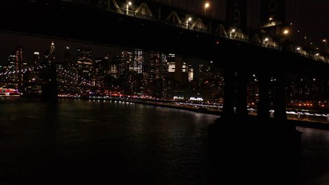 night rising next to Manhattan Bridge revealing downtown NYC