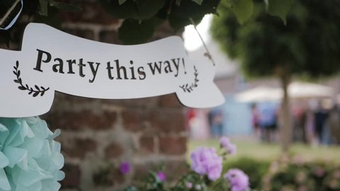 Party this way sign on wedding.