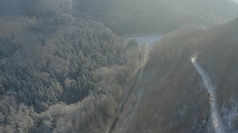 Flying along a mountain road in winter in the black forest
