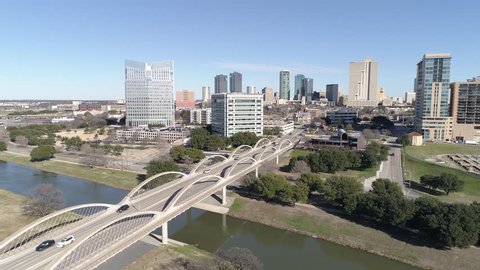 Aerial shot of Fort Worth, Texas sideline moving along side the 7th street bridge.
