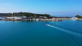Aerial drone video of beautiful peninsula of Vouliagmeni and laimos with luxury resorts and private beach of Asteras, Athens riviera, Attica, Greece