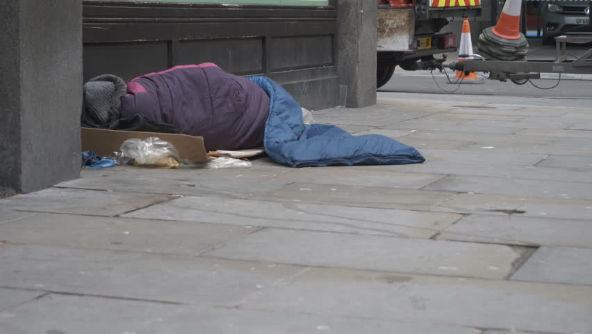 A homeless man sleeping on the street. Royalty-Free Stock Footage #1023993521