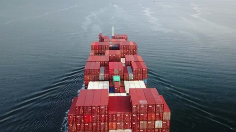 ISTANBUL - FEB 3, 2019: 1 minute long Drone Aerial Container ship cruising northbound on Straits Bosporus. ZIM ONTARIO Cargo ship full of containers on deck, sails out to Black Sea on a very calm day
