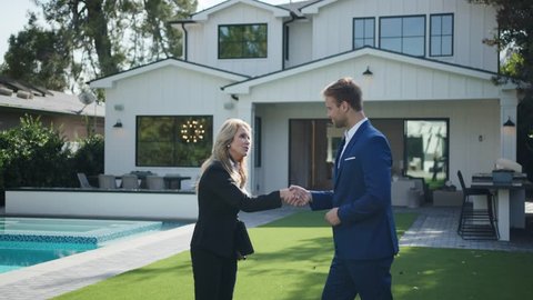 Realtor making a deal with wealthy client at open house / Selling Real Estate 