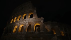 Glimpse of the Colosseum at night, in Rome illuminated by artificial light