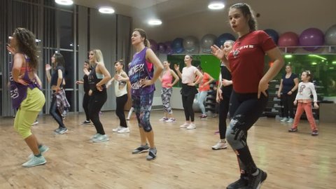 Skopje, Macedonia - December 2 2018: Humanitarian event. Zumba fitness class organized by couple of instructors. Girls, boys and children dancing zumba in Synergy fitness center in Skopje, Macedonia