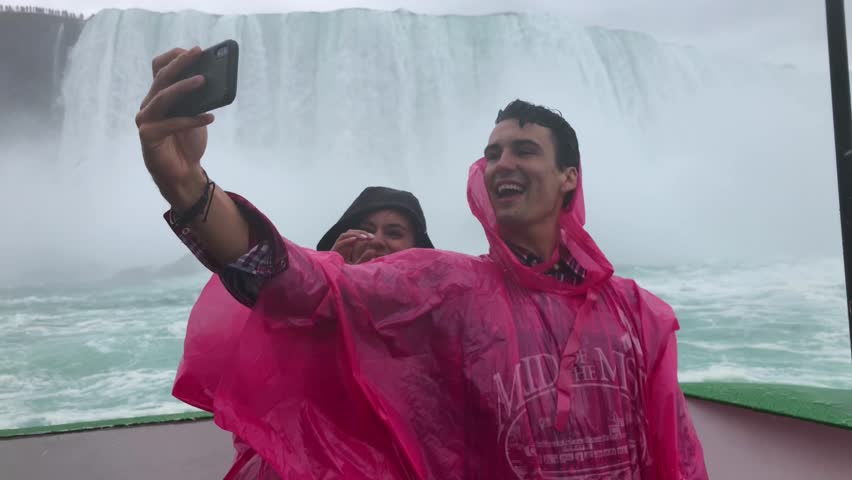 Happy Couple Takes Selfie on Boat at Niagara Falls, Tour Excursion
