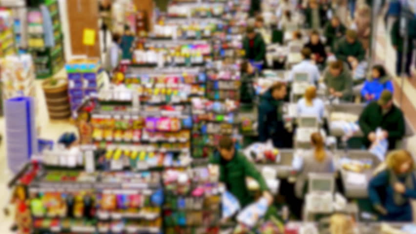 Cashier at supermarket / Retail checkout / Paying groceries. Unrecognizable buyers with carts move in queues to pay for purchases at the supermarket cashier. Fast motion. Royalty-Free Stock Footage #1024041641