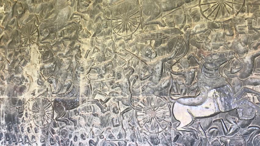 Wall engraving telling historical story at angkor wat temple. 