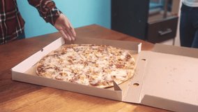 happy teamwork group people of friends with eating pizza box concept. slow motion video. human hands take pieces of Italian pizza from an open box. pizza fast food delivery lifestyle service