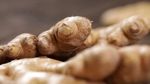 Ginger Root Falling onto other Ginger Roots, Closeup