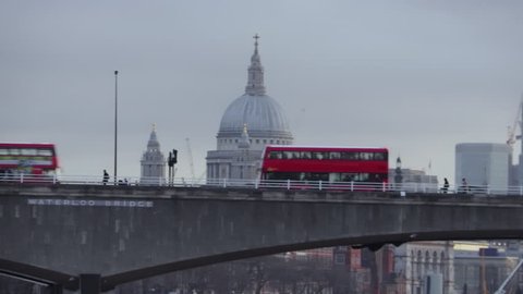 London Buses go past St Paul's Cathedral
