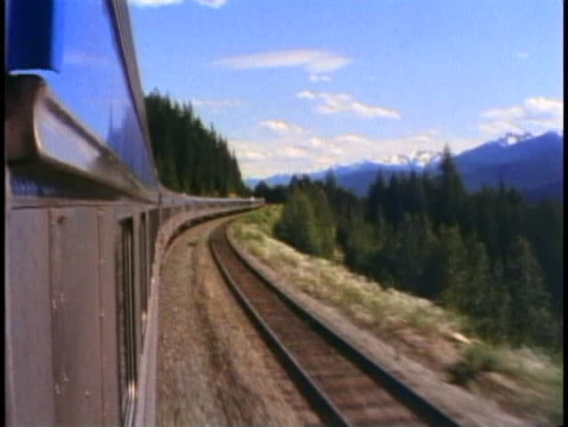 THE CANADIAN TRAIN, 1990, POV from train, forward shot, pine trees