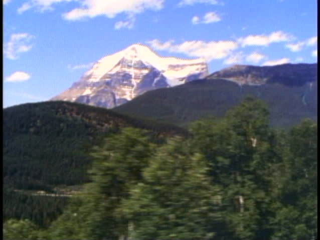 THE CANADIAN TRAIN, 1990, POV from train passing Mount Robson
