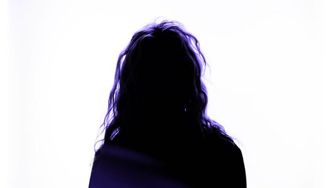 Abstract blue silhouette of a depressed woman flipping her hair and hanging her head with a white studio background