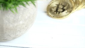 Bitcoins on wooden table. Selective focus. Tracking shot.