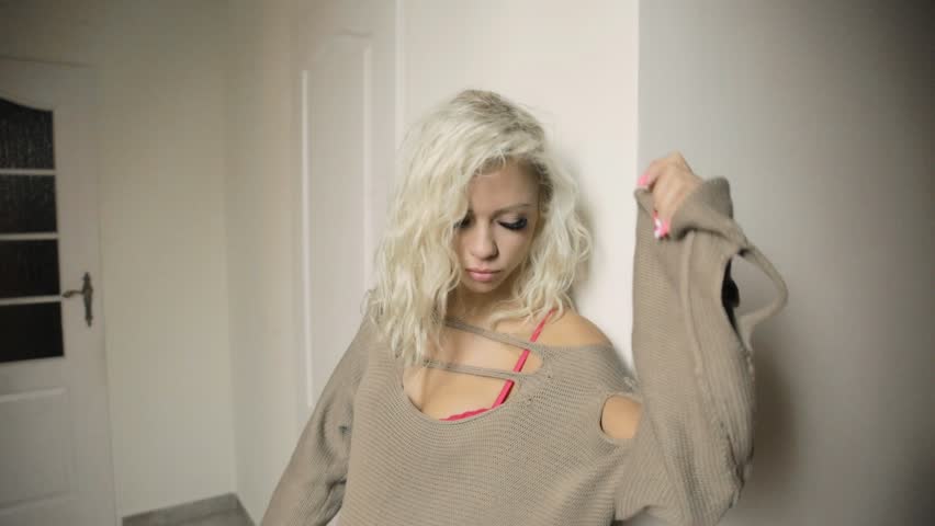 Medium shot of a sexy soulful woman posing indoors