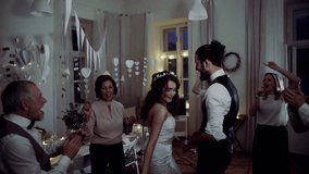 A young bride and groom with other guests dancing on a wedding reception. - Powered by Shutterstock - Get 15% off with code: PIKWIZARD15