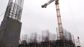 Video of a crane in the middle of a construction site
