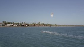 Drone flying alongside a Kite Boarder in Ilha do Guajiru, Brazil