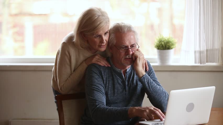 Excited happy senior old family couple winners using laptop overjoyed by unbelievable online betting bid playing internet casino game lottery win screaming with joy looking at computer screen Royalty-Free Stock Footage #1024093973
