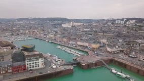 Aerial horizontal moving video of the city and its marina in Fecamp Normandy France
