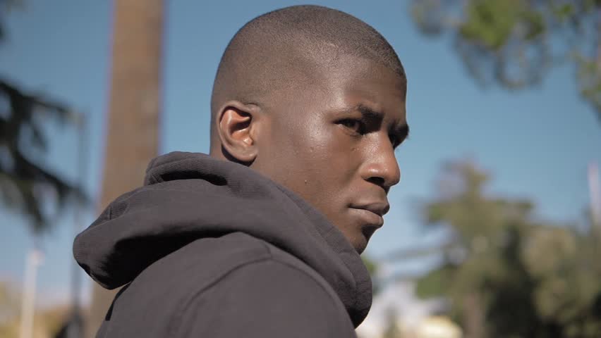 Proud attractive young black africam man looking-oudoor-slow motion