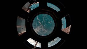 Earth through the porthole of the ISS. Elements of this video furnished by NASA