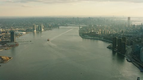 Aerial view of the East river and the bridges and buildings, skyline New York City. New York Aerial. Shot on 4k RED camera on helicopter.
