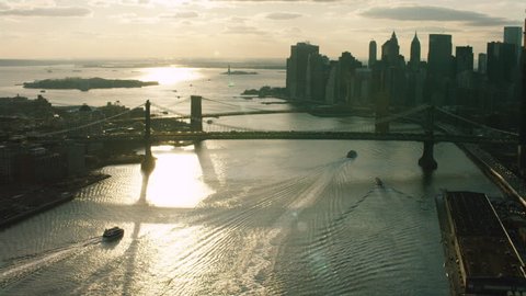 Aerial view of the East river and the bridges and buildings, skyline New York City. New York Aerial. Shot on 4k RED camera on helicopter.