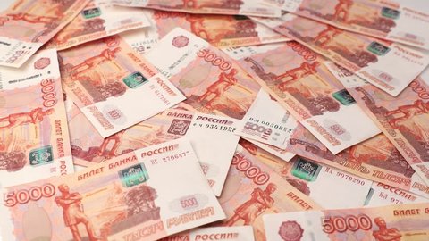 Stack of banknotes and keys, many banknotes of five thousand Russian rubles as a background, packed stack of banknotes 5000 rubles, five hundred thousand