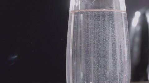 Limescale closeup shot, hard water in transparent glass.