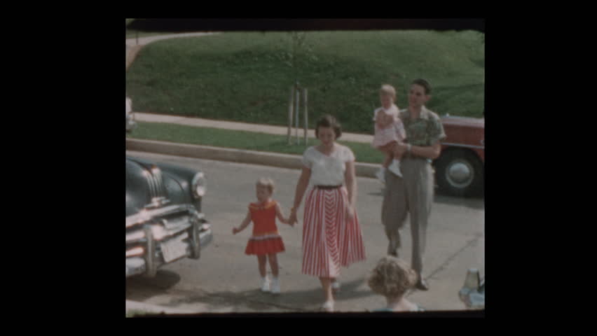 Baltimore, Maryland, USA- 1956: Neighbors and antique cars suburban street