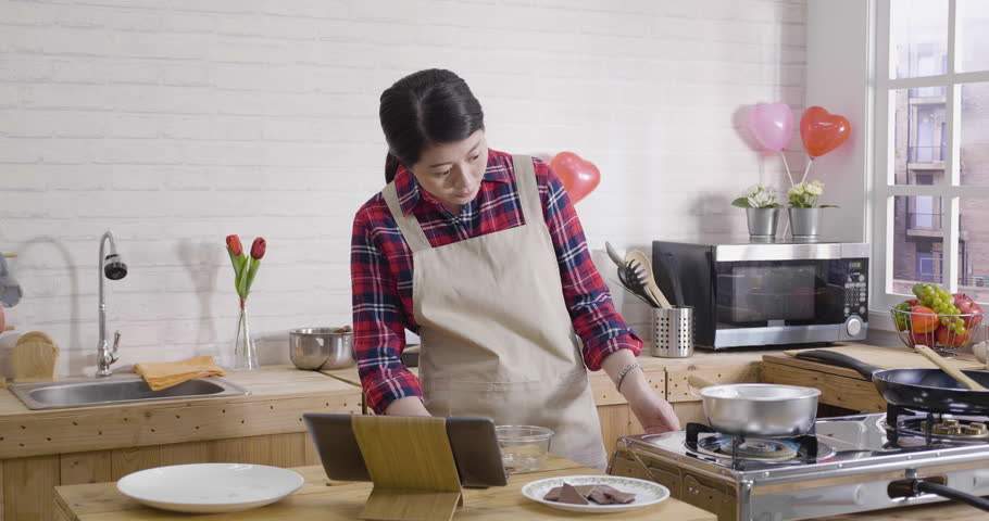 Asian Female Turning On Kitchen Stock Footage Video (100% Royalty-free) 1024124819 | Shutterstock