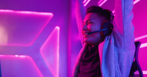 Young Asian Handsome Pro Gamer win in Online Video Game