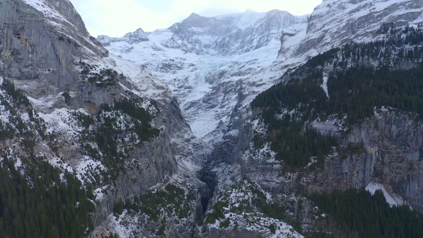 Aerial View, flight to Mittelhorn and Schreckhorn at the Upper Grindelwald Glacier in cloudy weather, Interlaken - Oberhasli, Canton of Bern, Switzerland