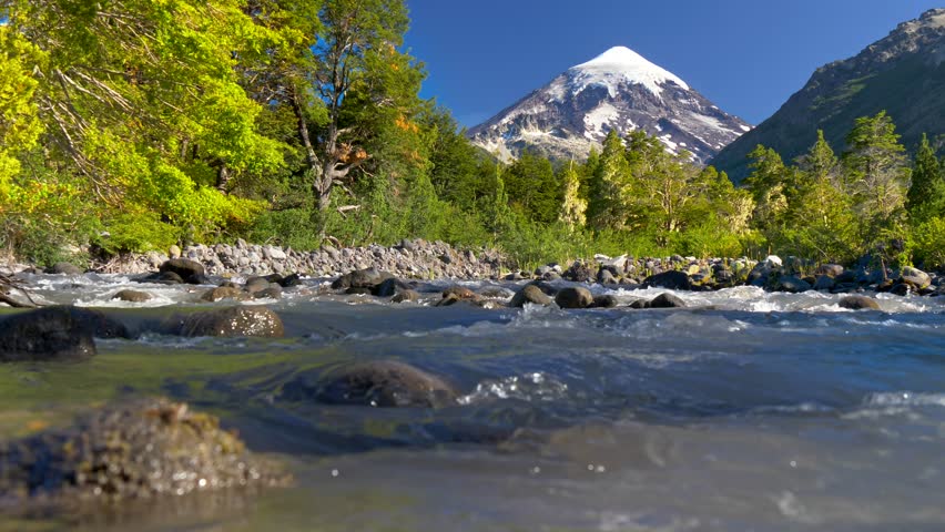 Lanin volcano in Lanin national park. Landscape with volcano, mountain river and green trees. Argentina, Patagonia, Lake district Royalty-Free Stock Footage #1024143566