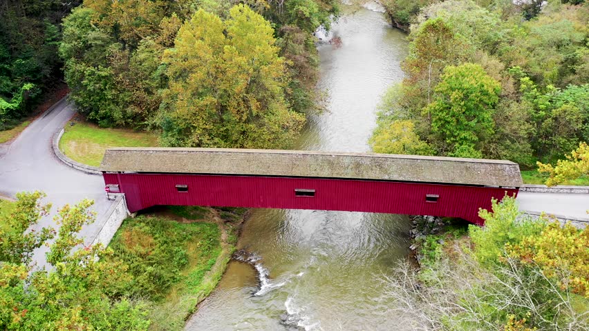 Aerial full length of the Colemanville Covered Bridge Lancaster Pennsylvania.Concept: fall, autumn, traditional, rural,Pennsylvania,countryside, Amish