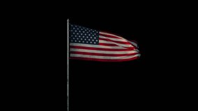 Flag of the US (United States of America ) on flagpole waving on wind, realistic 3d animation on black seamless loop, 20 seconds long (alpha channel is included)