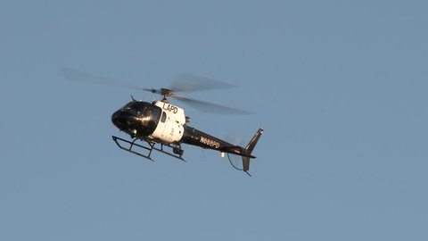 LAPD helicopter flying overhead patrolling the area.