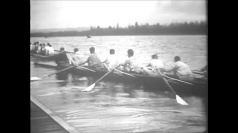 CIRCA 1920s - Black and white footage of competitive rowing in the 1920's